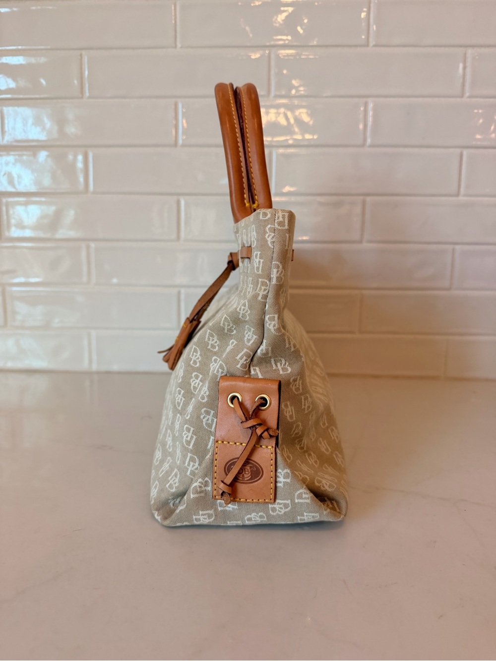 Dooney & Bourke tassel tote with brown leather handles - Picture 4 of 12